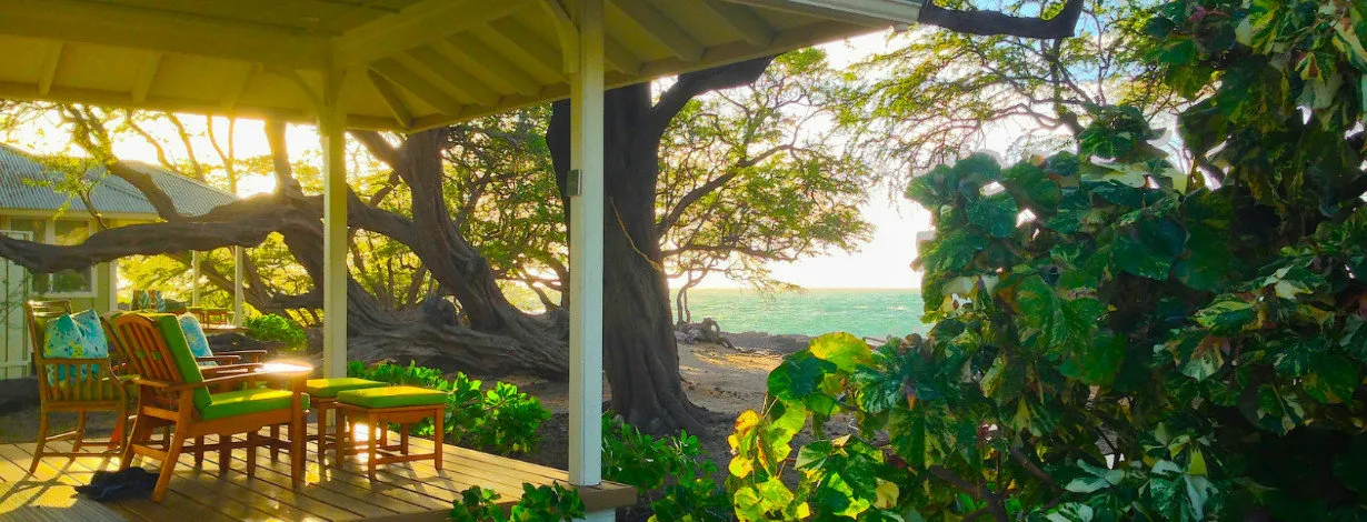 Shaded cottage lanai beside the beach